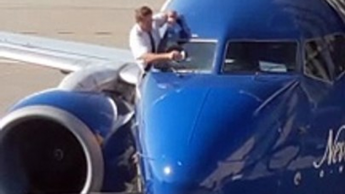 Airline Pilots Manually Wipe Windshield before Flight