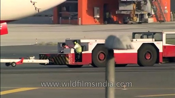 Air India Boeing plane is towed off runway, Delhi airport