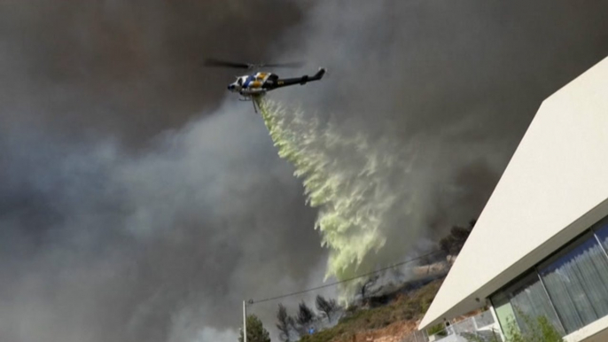 Wind-fueled wildfires force evacuations in Greece