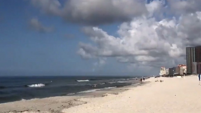 Heavy clouds hang over the beach