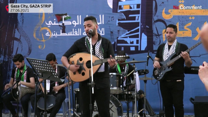 Gazans watch music concert amidst rubble