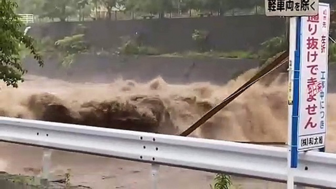 Torrential seasonal rain in Japan sparks landslides and flooding