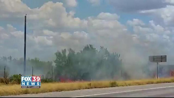 Grass fire reporter on Highway 59