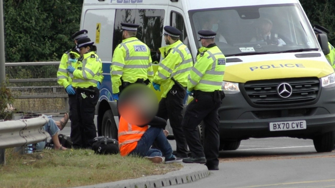 Chaos caused dozens arrested as climate change protesters glue themselves to the M25