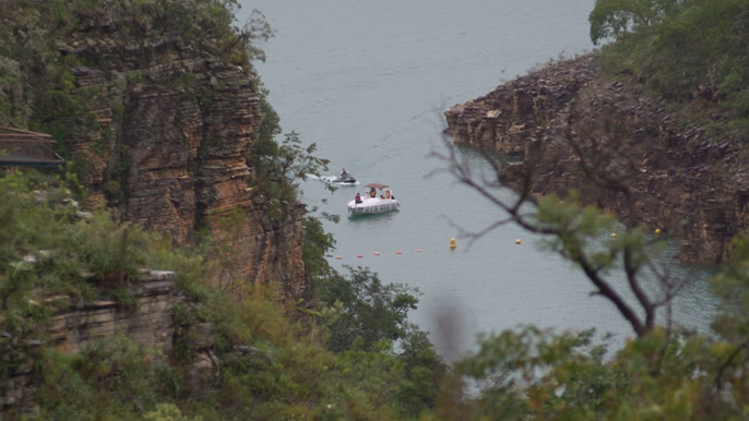 Terrifying moments caught on camera as a cliff collapses onto tourists on a Brazilian lake