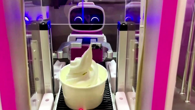 Robot serves ice cream to Beijing Olympic visitors