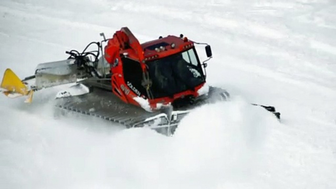 A Snow Grooming Machine is Preparing Ski Slope