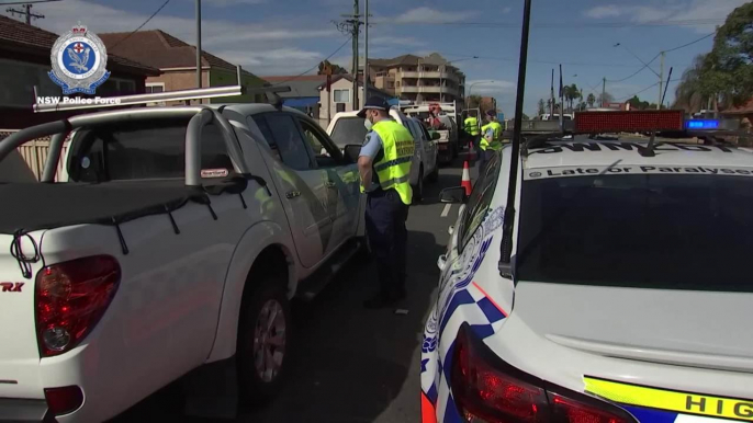 Police conducting car checks on Woodford Road, Guildford NSW during Operation Stay At Home - August 2021 - ACM