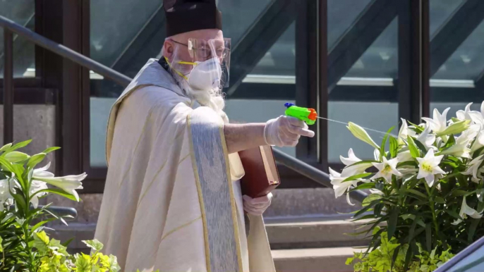 In Detroit, a Priest Is Battling Coronavirus With a Squirt Gun