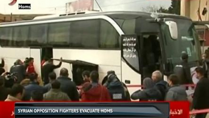 Syrian opposition fighters evacuate Homs