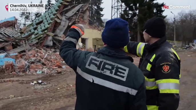 Rescuers clear rubble from damaged houses in Chernihiv