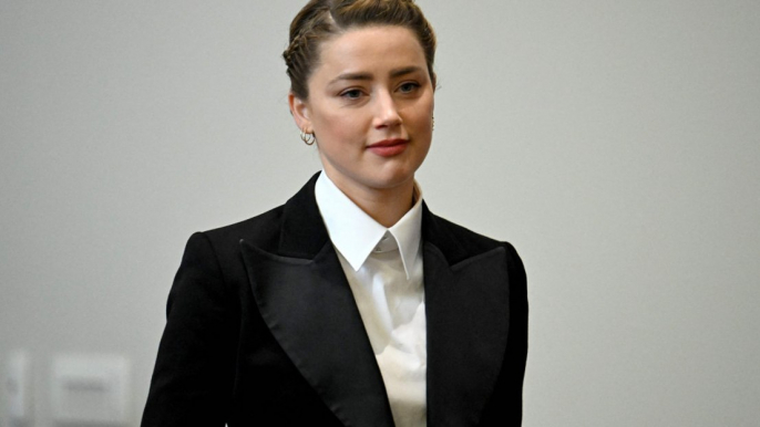 Amber Heard has denied leaving faeces in her marital bed