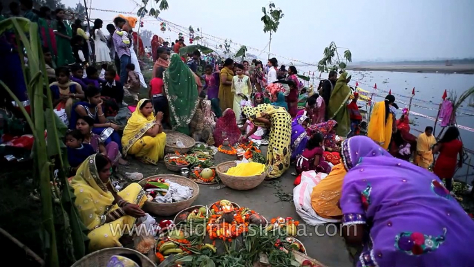 Hindu women devotee performing rituals during the Chhath Puja festival