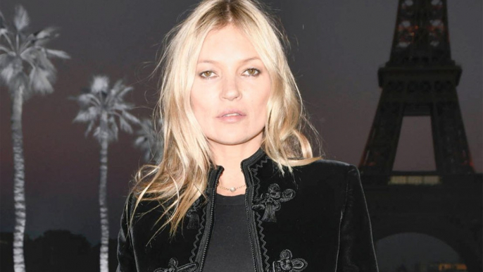 Kate Moss has denied a rumour that her ex Johnny Depp once pushed her down the stairs