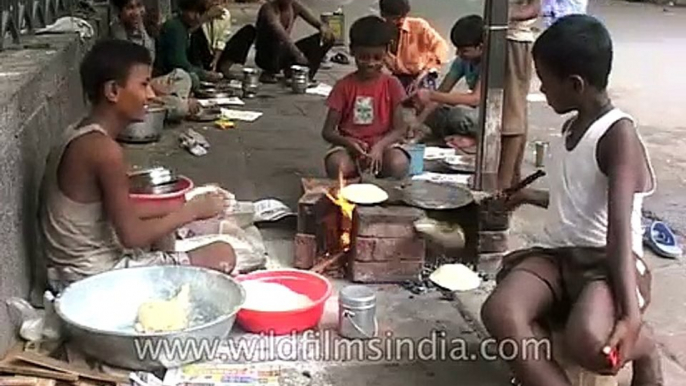Children run road-side Dhaba in India, with kid scratching his crotch!