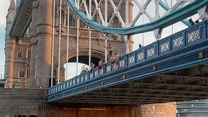 Daredevils film dramatic backflip into ‘dangerous’ River Thames from Tower Bridge