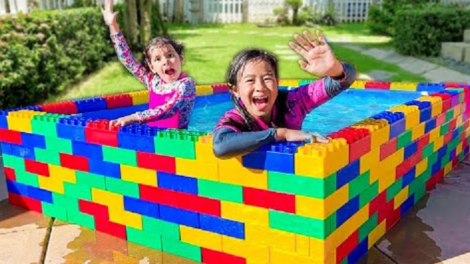 Jannie and Ellie Learn to Swim in the Kids Lego Pool and Plays with Fun Water Toys