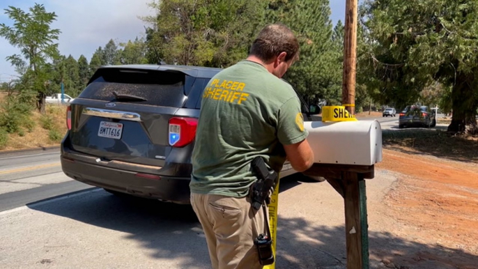 Wildfire evacuees, firefighters face sweltering heat wave