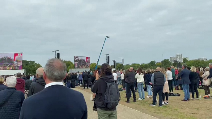 Viewers in Hyde Park stand as Queen Elizabeth II's coffin enters Westminster Abbey