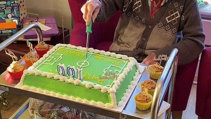 Wolves fan Frank Rhodes cuts football-themed birthday cake on 100th birthday