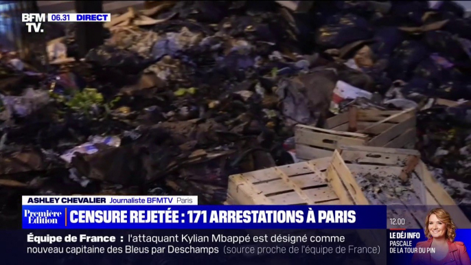 Retraites: dans le quartier de l'Opéra à Paris, les rues jonchées de poubelles incendiées après la manifestation