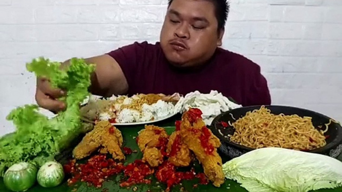 Mukbang Fried Chicken with Spicy Sauce, Fried Noodles, Rice, Raw Vegetables, Crackers, Lettuce and Eggplant