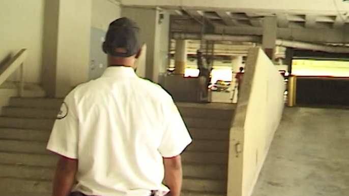 Skateboarder does 180 off of stairs and crashes into security guard