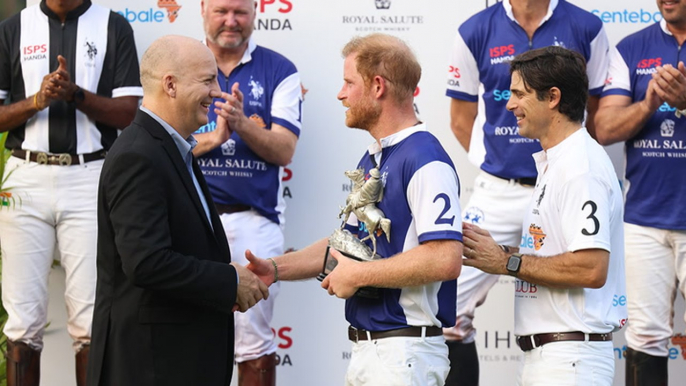 Prince Harry awarded trophy after taking part in charity polo match in Singapore