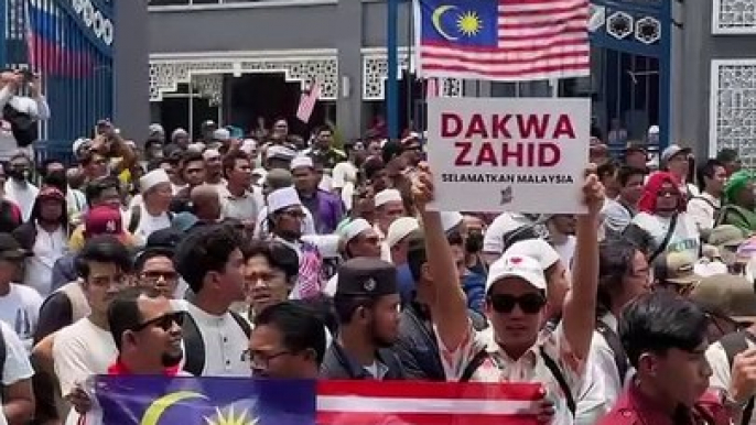 Hundreds of demonstrators gather at Kampung Baru mosque on Malaysia Day