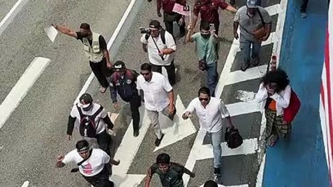 Demonstrators gather at Kampung Baru mosque on Malaysia Day