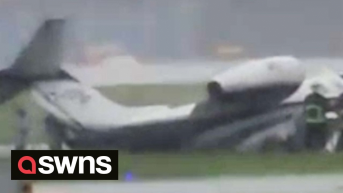 Terrifying moment private plane carrying eight people skids off runway amid bad weather