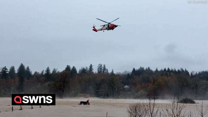 Coast Guard rescue people from flooding conditions near Rosburg, Washington