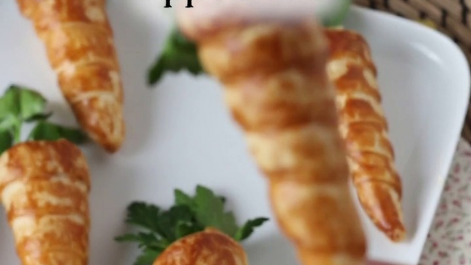 Carrot shaped croissant cones : a cute easter appetizer with goat cheese and sun-dried tomatoes