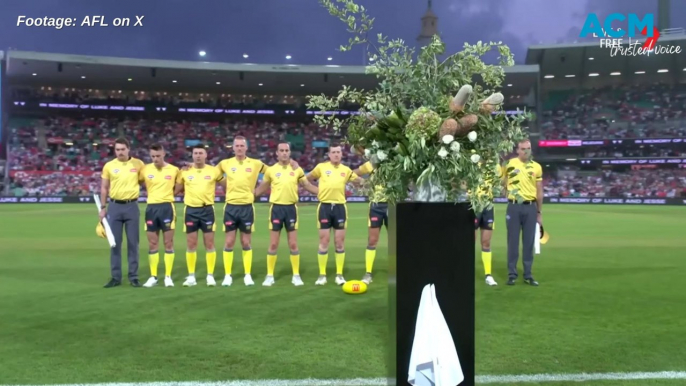 AFL players and umpires hold tribute to goal umpire Jesse Baird and partner Luke Davies.
