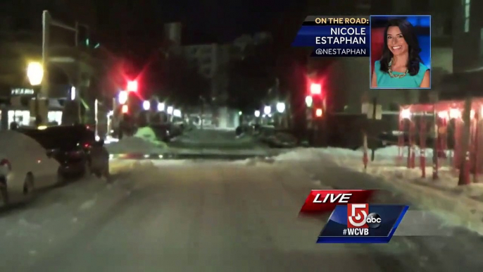 Snow-covered cars line Boston streets