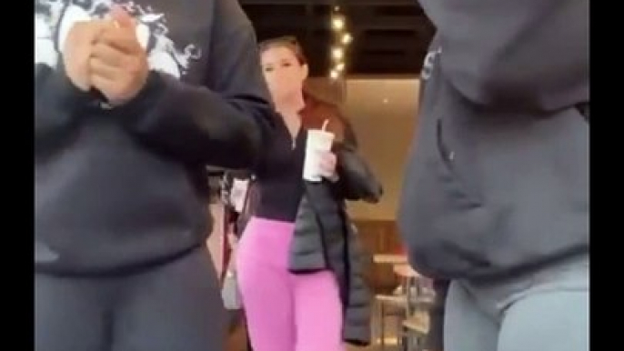 Two young women make it obvious to this woman that they don't like her