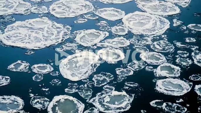 Frozen river with ice floes static shot