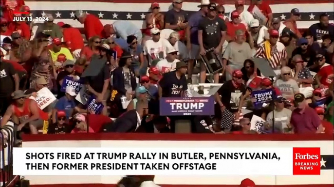 BREAKING NEWS: Shots Fired At Trump Rally Former President Pumps Fist As Hes Rushed Off Stage