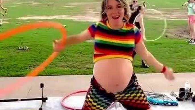 Pregnant Woman Spins Hula Hoop Around Belly