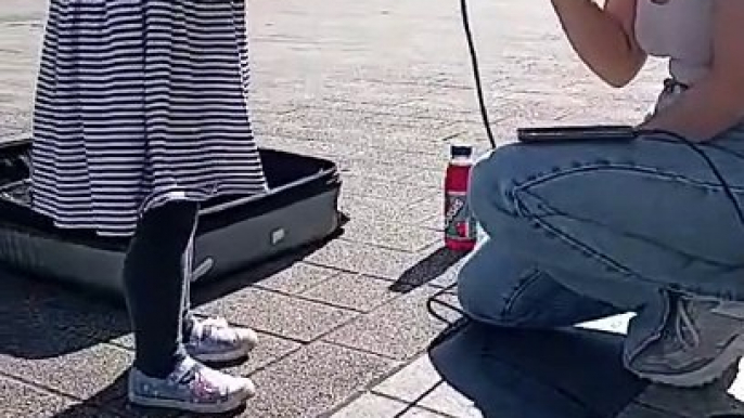 Watch the heart melting moment this three-year-old approaches Burnley busker and asks for her favourite song