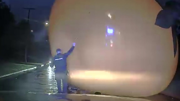 Watch: Giant runaway inflatable pumpkin swallows police officer responding to 911 call