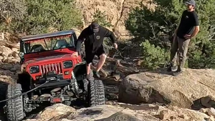 Man Climbs on Tire and Falls After Tire Starts Spinning