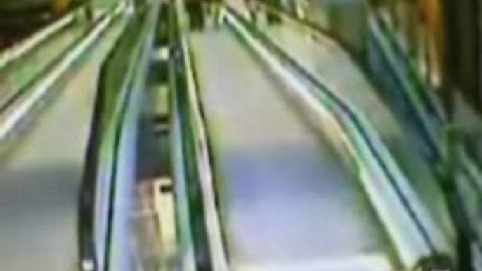 Madrid Woman Falls Down Escalator